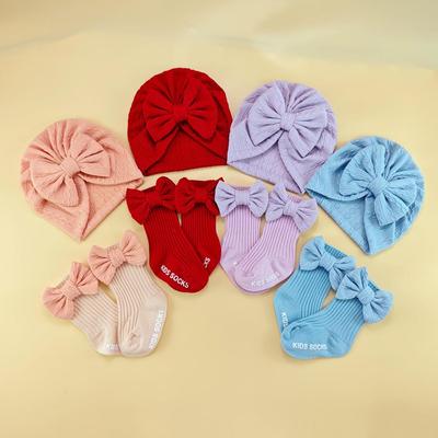 Set Cappellino e Fascia con Fiocco per Neonato Transfrontaliero con Calzini