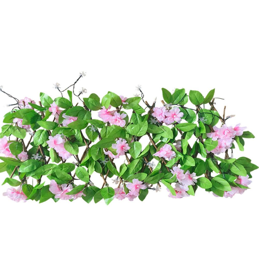 

Artificial Solar Hedge Fence Designed for Outdoor Use with Weather Resistant Construction and Ambient Night Lighting