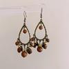 Ethnic Style Triangle Flowing Water Earrings, High-end Earrings, Niche Antique Style, Personalized Creative Design Earrings
