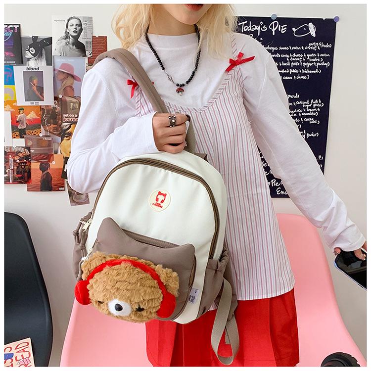 Cute Cartoon Trendy Backpack: Large Capacity, Lightweight, Versatile Travel/School Bag with Earphone and Doll Holder.