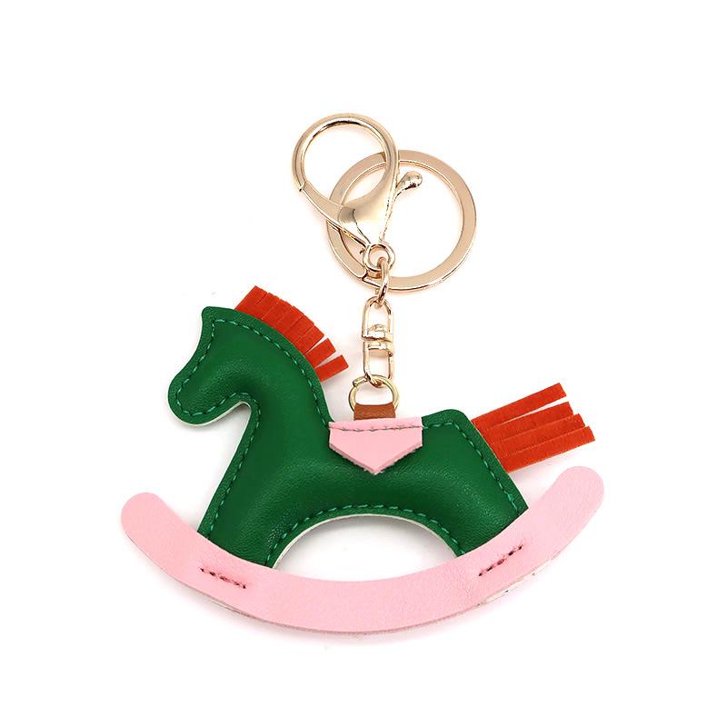 Cartoon Rocking Horse Keychain: Creative PU Leather Pony Charm with Cotton Filling.