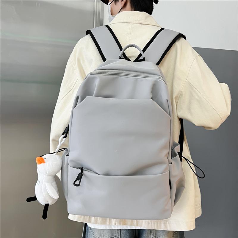 Schoolbag large capacity solid color backpack female Korean version simple versatile schoolbag male junior high school backpack female