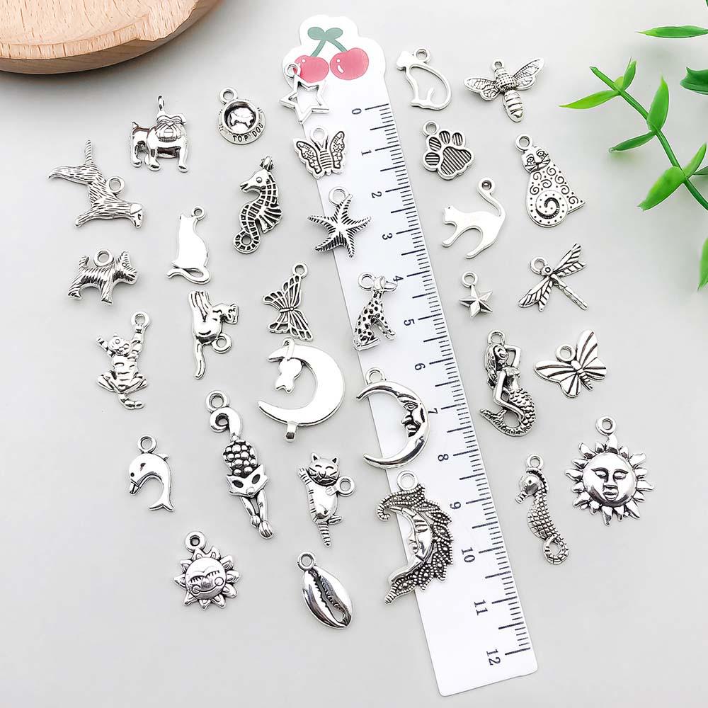 Set di 100 Ciondoli Gatto Farfalla Luna Argento Antico per Braccialetti e Collane Fai da Te