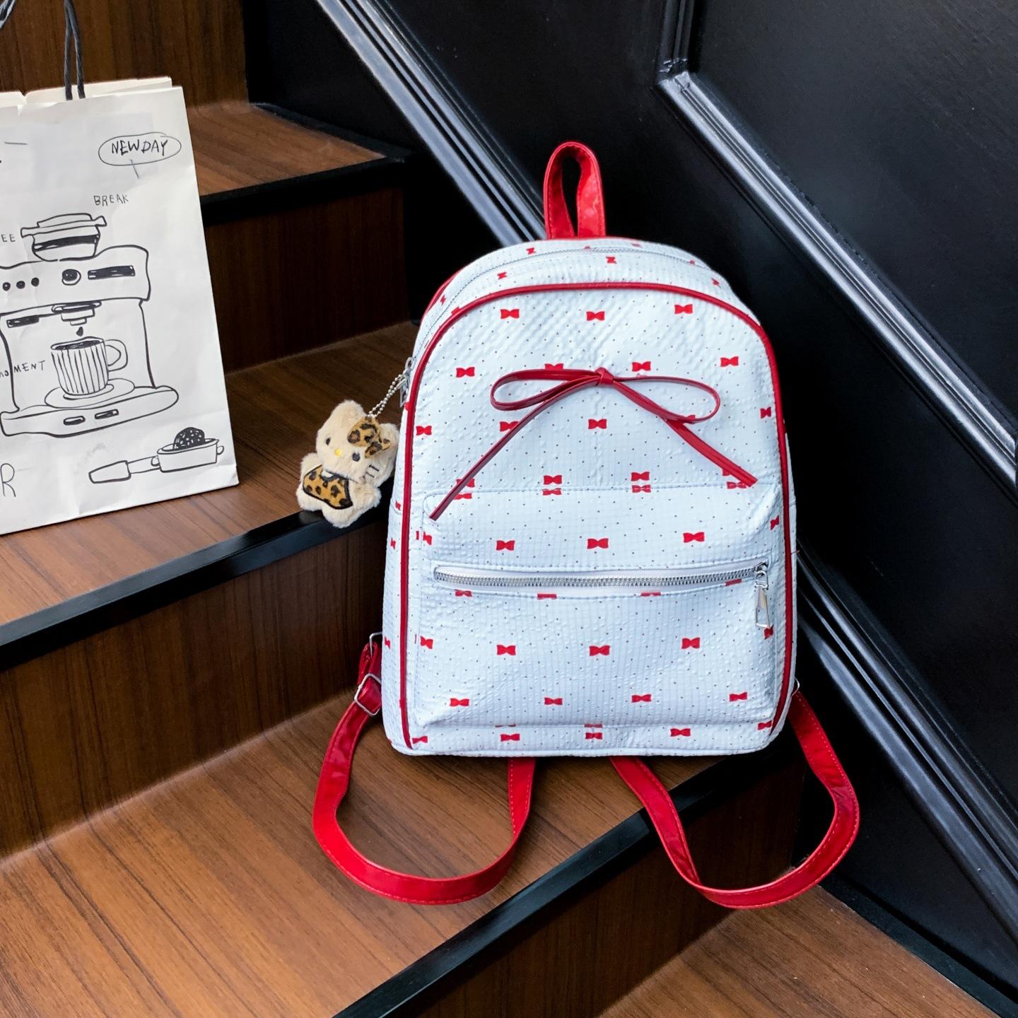 

Korean version of college style women s shoulder bag 2025 new summer fashion bow small backpack shopping commuter bag single bag синій