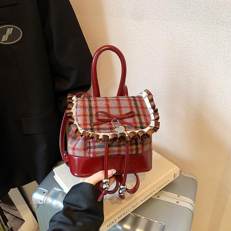 

Детский рюкзак в корейском стиле с клетчатым бантом и кружевной отделкой красный