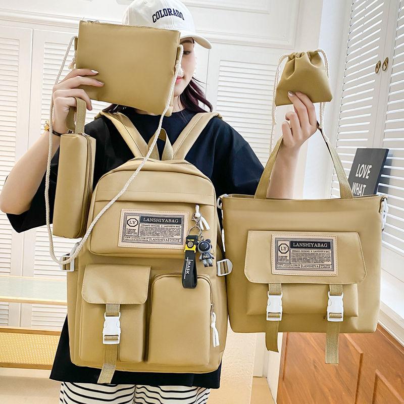 

Five piece backpack Male schoolbag Female junior high school student knapsack Cartoon pendant rucksack elementary school students grades three to six