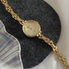 Vintage And Luxurious Small Dial Watch For Women, Featuring A Round Gold Case, Delicate Chain Strap, And A Stylish Design.