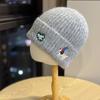 New cute puppy embroidered knitted hat for women, autumn and winter Korean version, versatile, warm, ear-protecting, face-slimming woolen hat