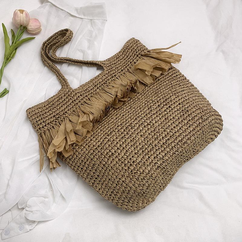 

New straw woven bag women s fringed niche woven bag shoulder bag large capacity seaside beach vacation tote bag
