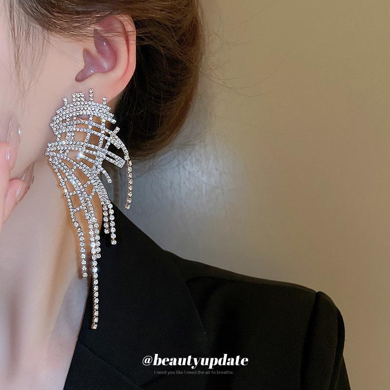 Silver needle with diamond wings hollow fringed earrings European and American exaggerated earrings temperament light luxury earrings women