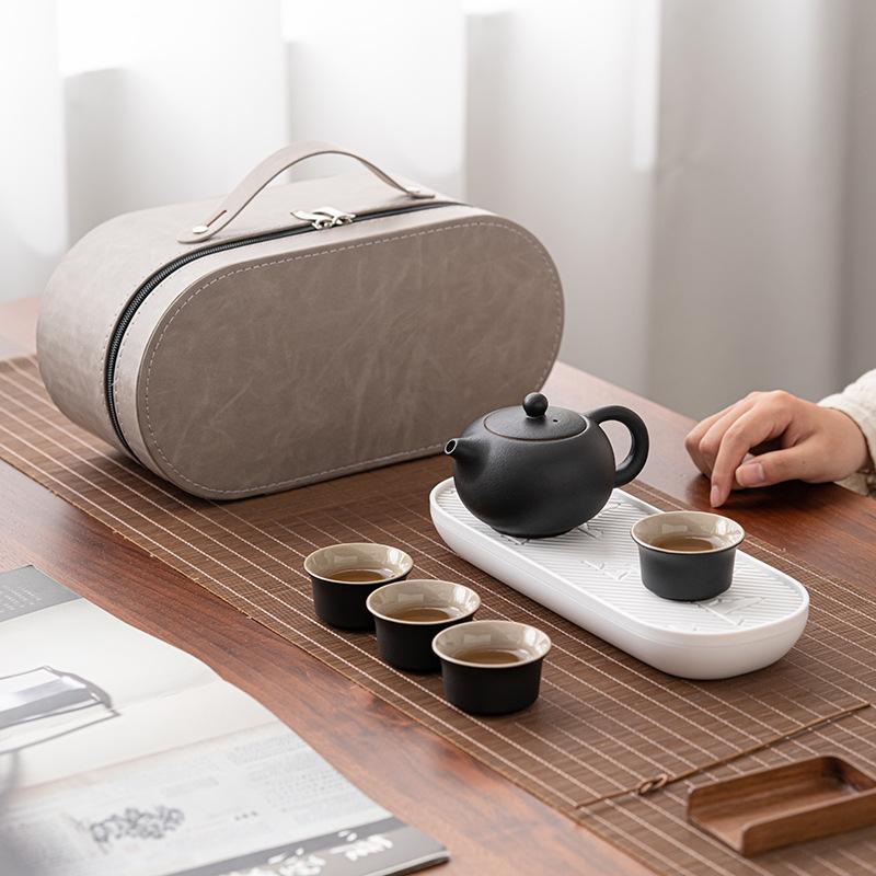 

Coarse pottery travel tea set Kung Fu tea set travel bag outdoor one pot four cups portable beam pot tea maker