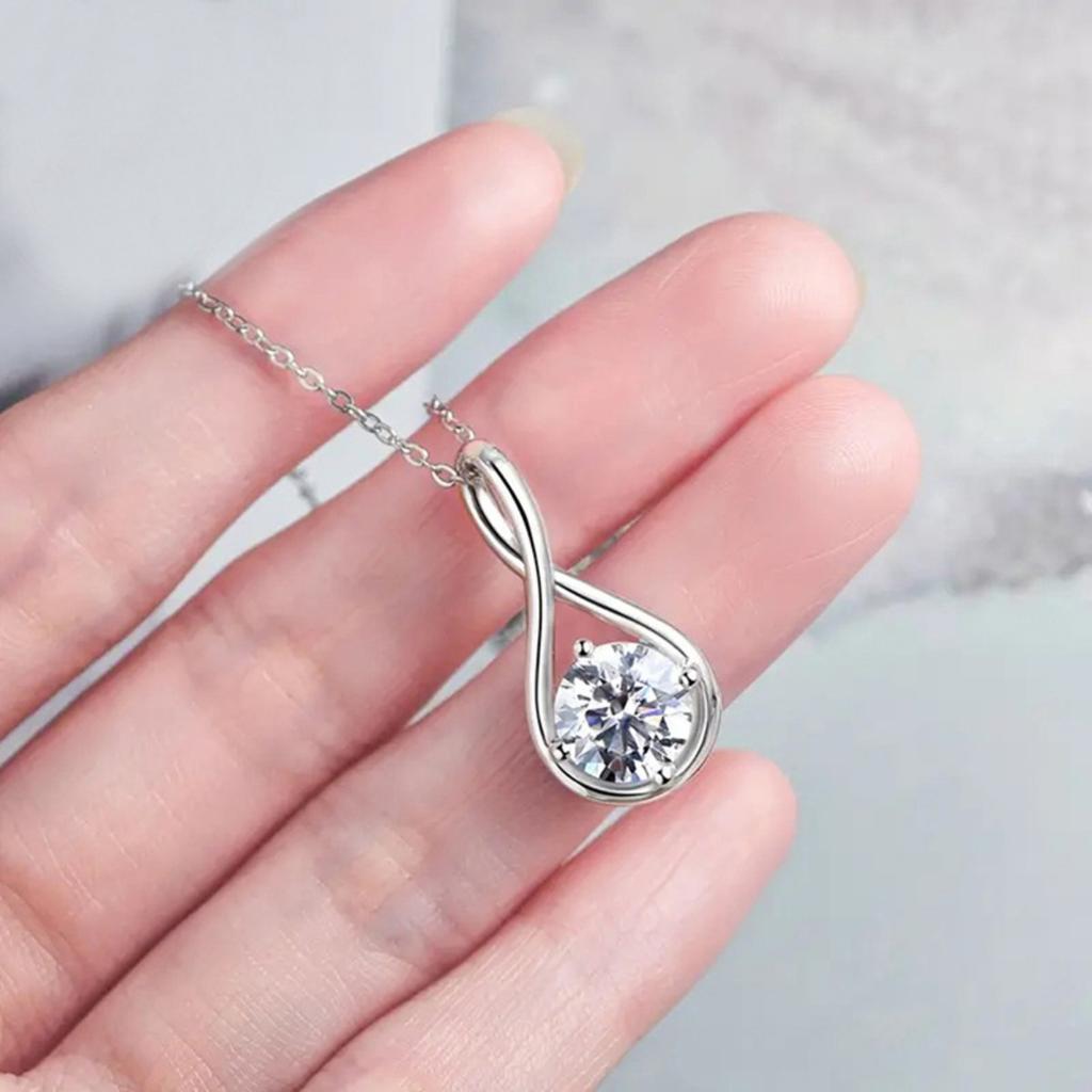 Infinity Twist Pendant Necklace with Brilliant Round Center Stone Elegant Symbolic Jewelry for Women