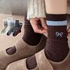 The Women's Mid-calf Socks with A Retro Striped Style In Autumn and Winter, Paired with Loafers, Are Fashionable and Versatile