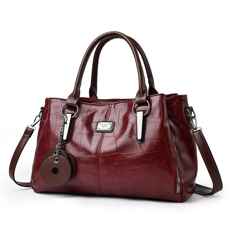 

Жіноча сумка в ретро європейському та американському стилі, великої місткості, з м якої шкіри, кольорова, сумка-тоут, сумка через плече, сумка для щоденного використання. 31*21.5*14cm бордовий