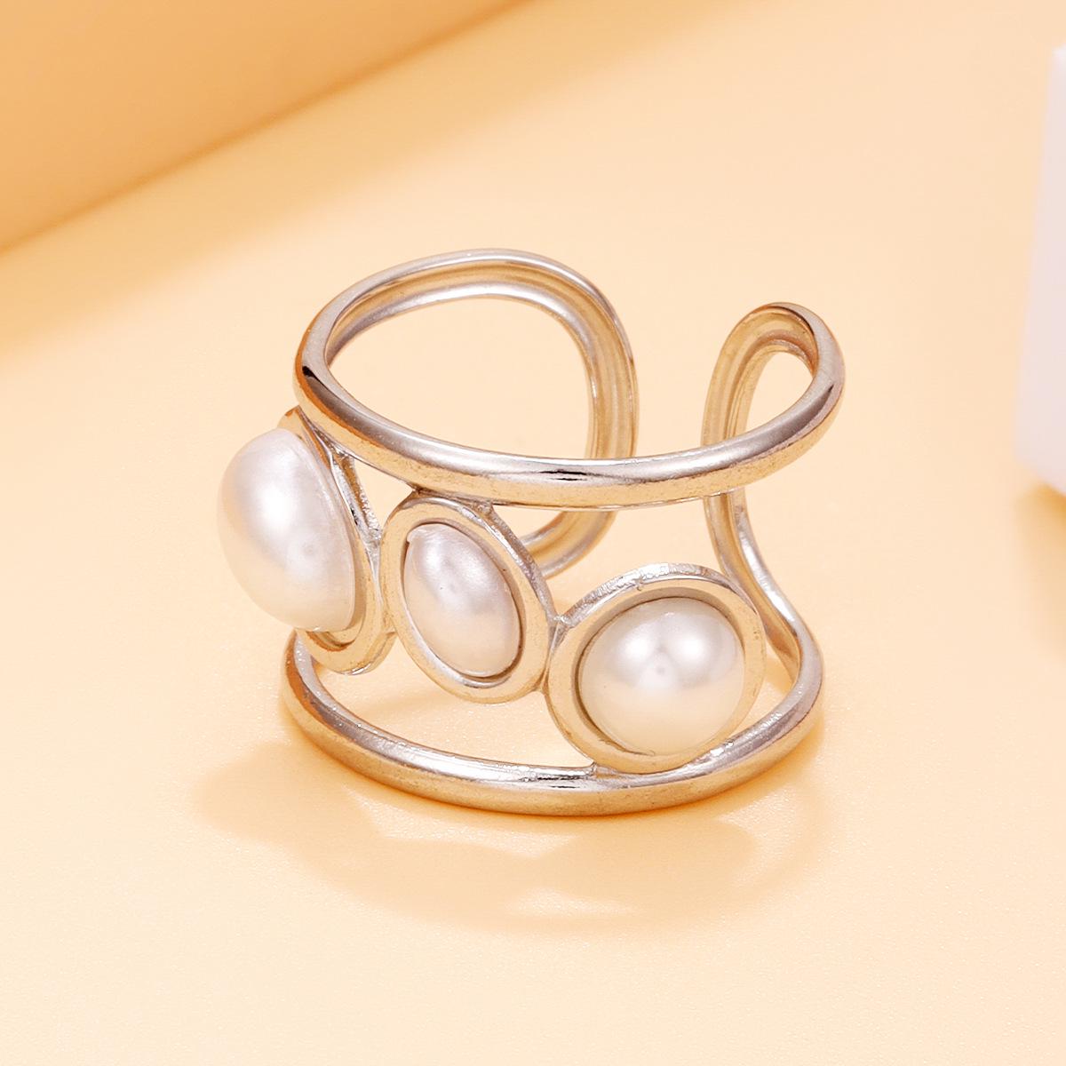 Elegant Vintage-Style Stainless Steel Ring with Geometric Design and Faux Pearl for Women.