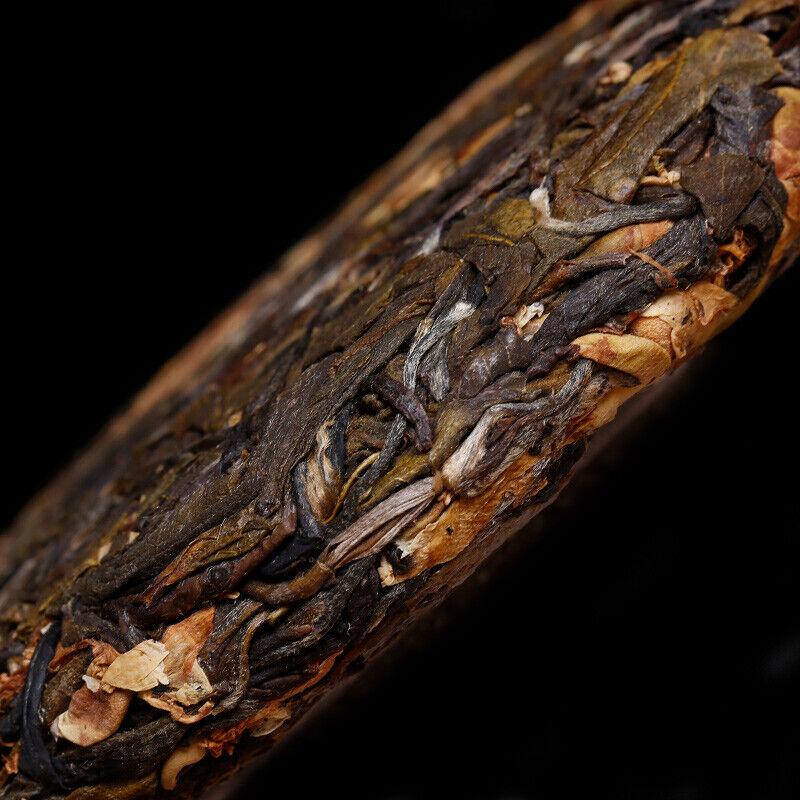 Discover 100g of Pu'er Raw Tea Plucked from Ancient Trees with Enchanting Floral Scent