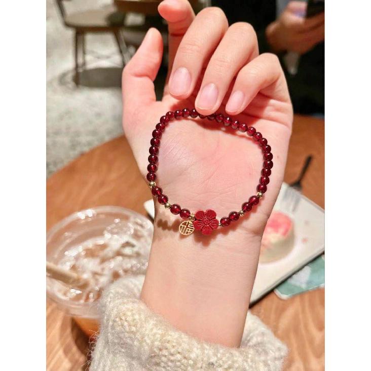 Here's a small red flower for you: a hand-woven bracelet made of cinnabar red garnet, the same style as the one featured on Little Red Book