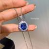Elegant Set: Diamond-Inlaid Pendant, Blue Spinel Ring, and Stud Earrings with Imitation Royal Blue Sapphire for Women