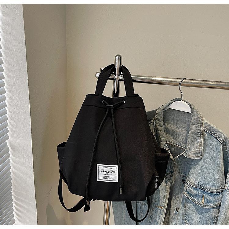 

2025 новый ремешок персонализированный рюкзак большой вместимости в стиле кэжуал для школы студенческий рюкзак корейская версия модный дорожный портативный рюкзак чёрный