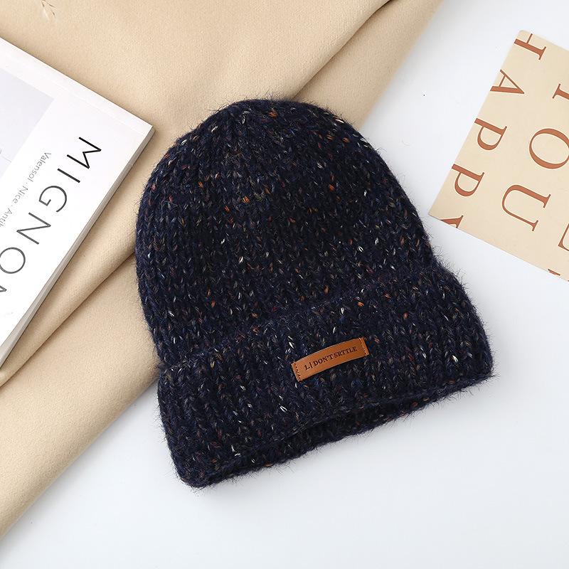 Autumn and winter pullover warm wool hat women's fashion leather label knitted confinement hat outdoor cycling sports hat