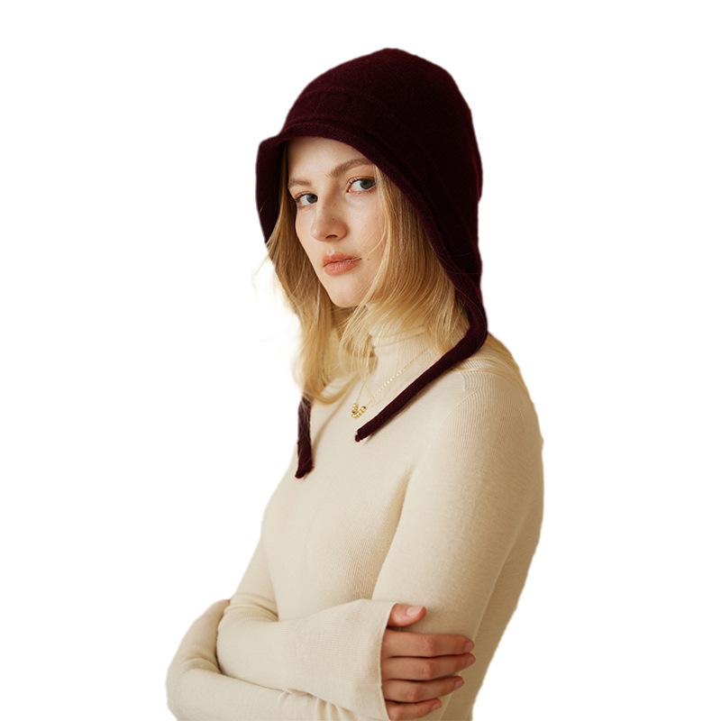 A New Autumn and Winter Style Women's Knitted Cap with A Solid Color Warm and Ear Protecting Edge  Featuring A Rolled Up Jacquard Strap