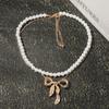 Light luxury imitation pearl fashion one more wear personalized metal bow pendant women's necklace