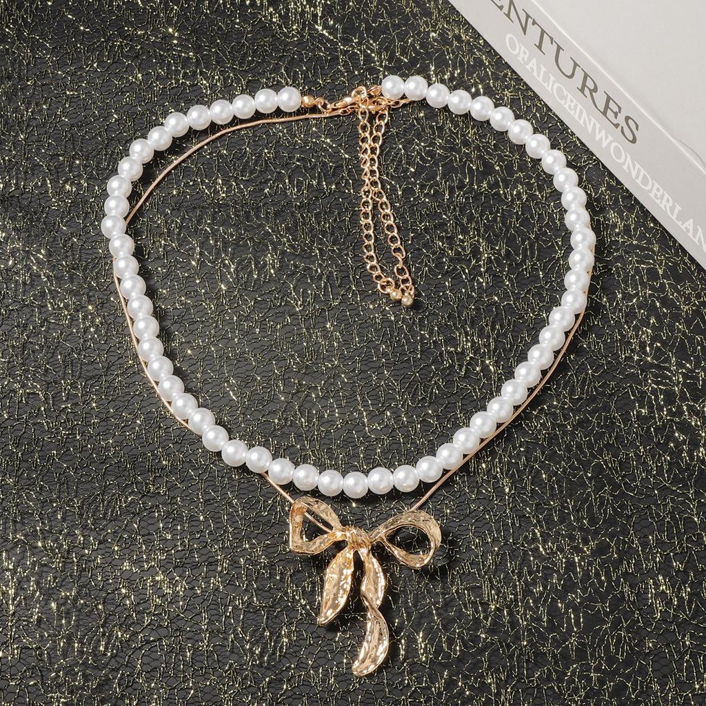 Light luxury imitation pearl fashion one more wear personalized metal bow pendant women's necklace