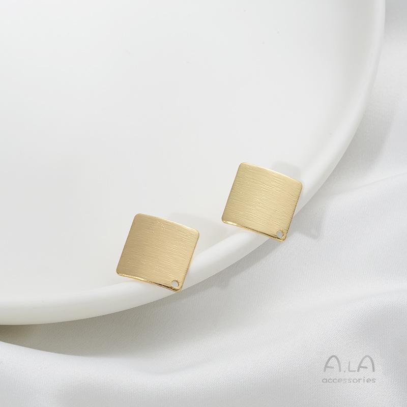 

Серьги-подвески в виде листьев лотоса из золота 14 карат с пусетами из стерлингового серебра 925 пробы