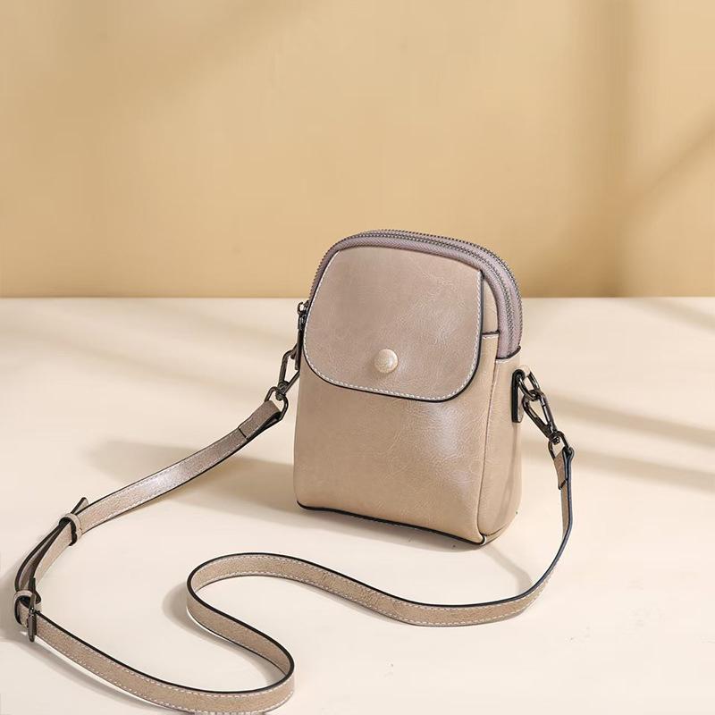 Leather small bag women's new spring and summer fashion vertical mobile phone bag cowhide multi-layer versatile shoulder messenger bag