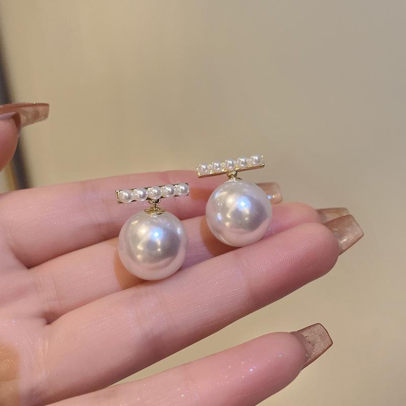 Fashion Geometric Bow Flower Pearl Earrings Women'S Premium Versatile Small Fragrant Wind Earrings