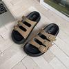 Korean version of casual one-word buckle holiday slippers for women's summer wear 2025 new thick-bottomed cork beach cool slippers