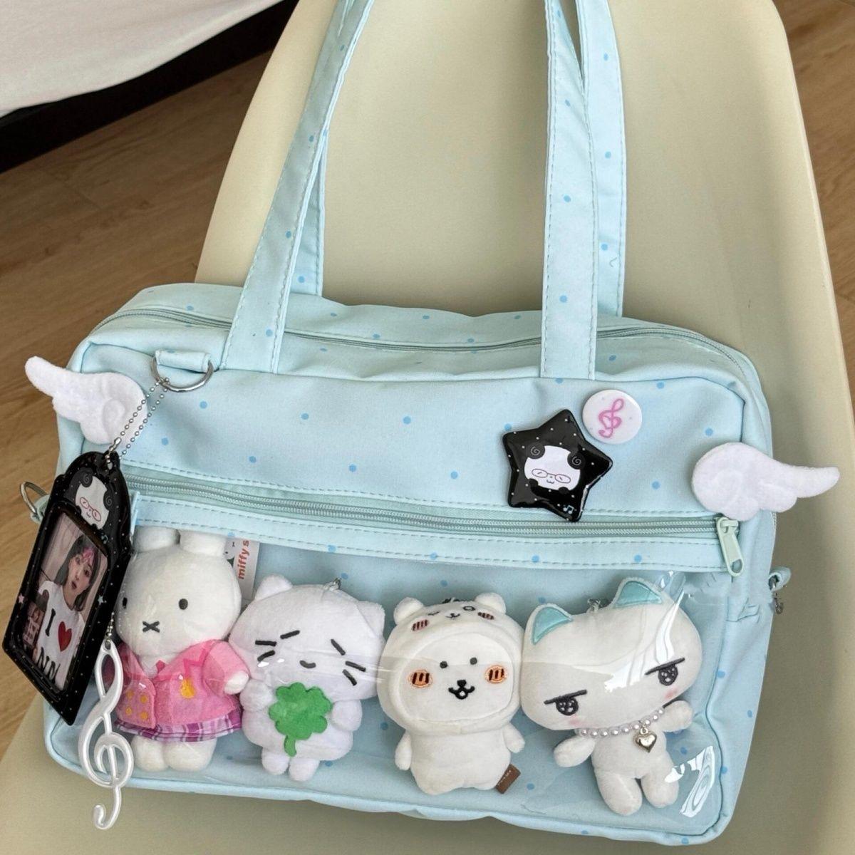 

Japanese two-dimensional yuan black and white polka dot pain bag women s 2025 new canvas portable tote bag large-capacity shoulder bag