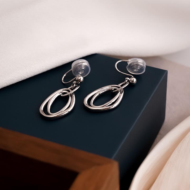 Niche Metal Circle Clip-On Earrings for Unpierced Ears - Fashionable, Mosquito Coil Design