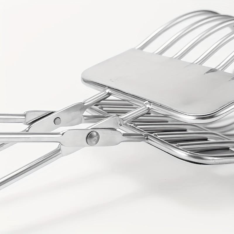 A Stainless Steel Beef Slicing Tongs For Cutting Meat And Bread Slices, Onion And Tomato Clip, Used For Cutting Vegetables And Fruits In The Kitchen.