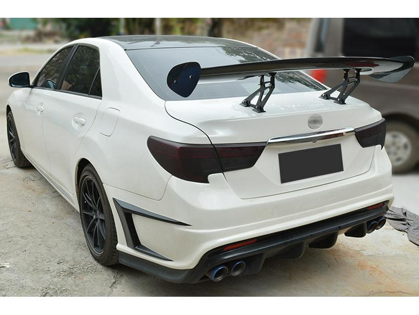 GT Universal Perforated Rear Spoiler Kit: Includes Bracket, Wind Deflector, Roof Spoiler, Rear Diffuser, Side Skirts, and Front Lip.