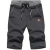 Pantaloni Corti Casual Versatili da Uomo alla Moda con Tasche e Cuciture Lente