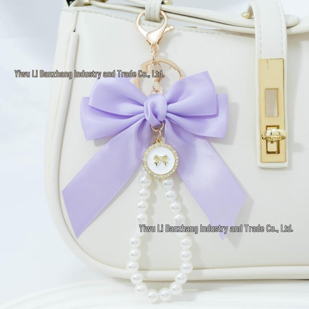 Large Bow Faux Pearl Bracelet Keychain with Colored Woven Strap and Alloy Tag Pendant