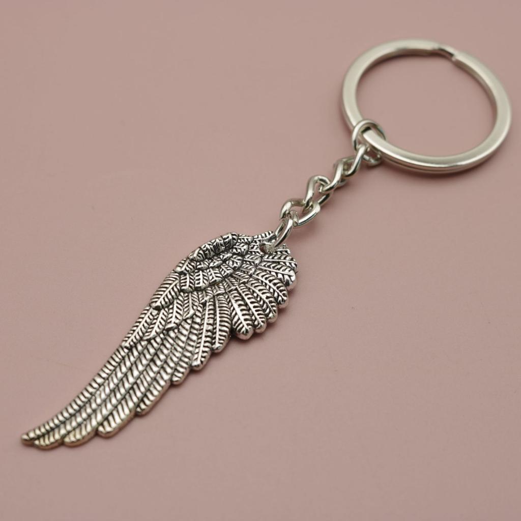 Schmuck, Minimalistischer Feder-Schlüsselanhänger-Anhänger