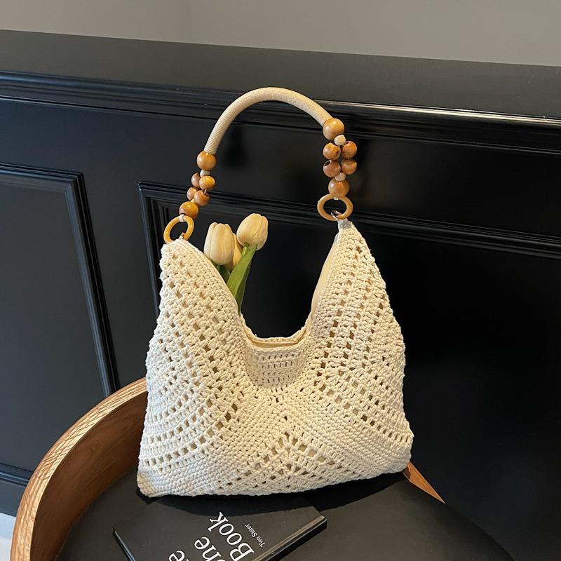 Seaside vacation beach bag women's new summer hollow bag commuting large capacity shoulder tote bag