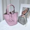 Spot wholesale top layer cowhide vegetable basket bag leather bucket bag commuter fashion lock buckle hand-held handbag woman
