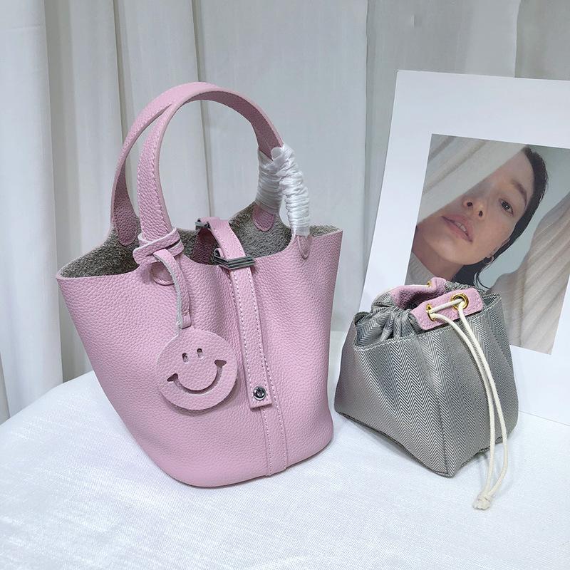Spot wholesale top layer cowhide vegetable basket bag leather bucket bag commuter fashion lock buckle hand-held handbag woman