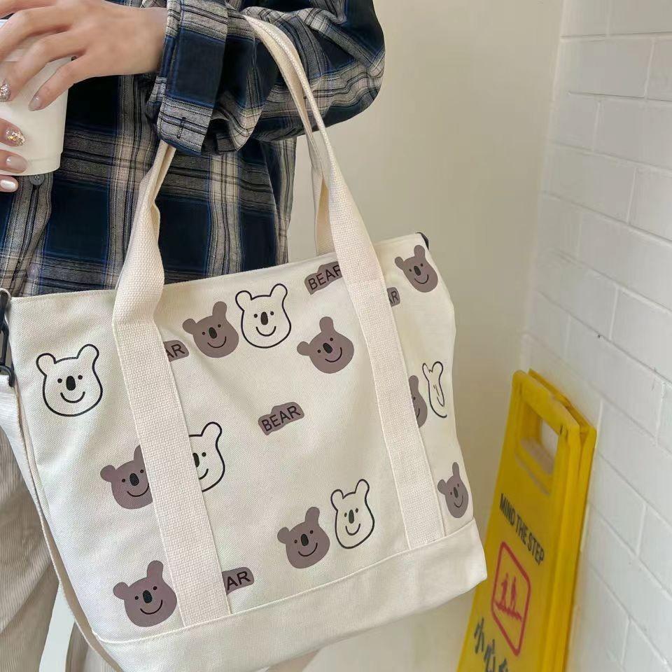 Large capacity versatile canvas shoulder bag bag female student make-up bag portable shopping bag cute AB bear bag