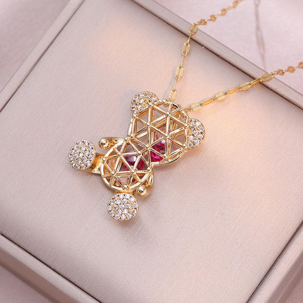 Damen Titanstahl Halskette mit goldenem Zirkonia, hohles Bär-Design, japanisch-koreanischer Stil, grenzüberschreitende Nischenmode.