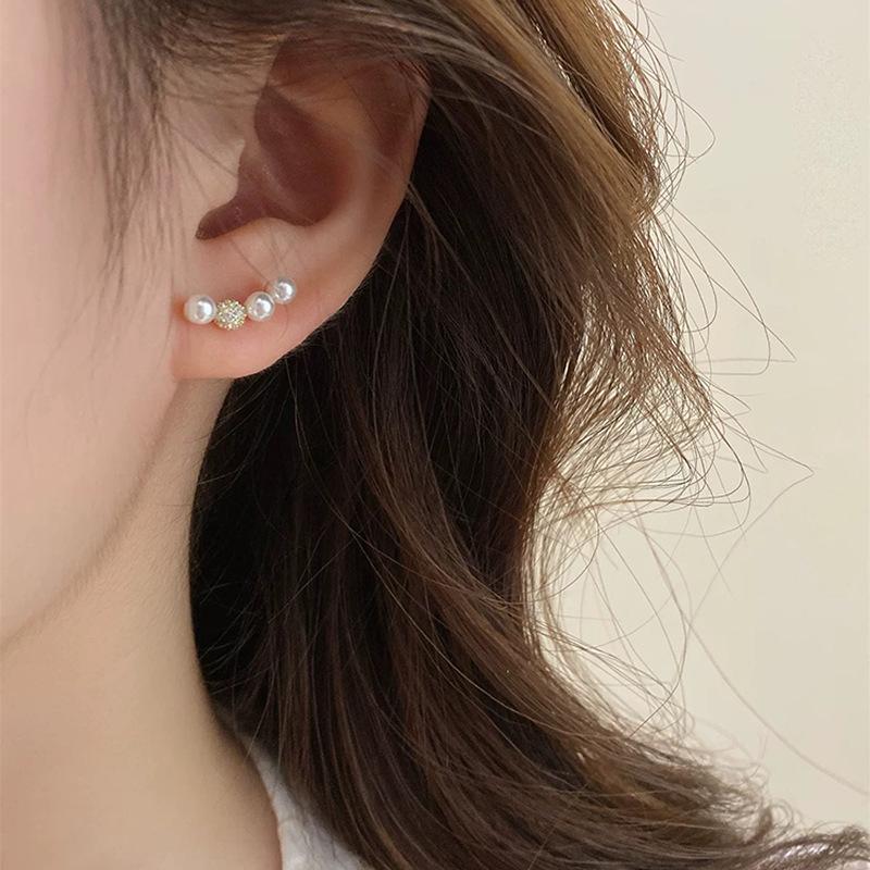 

Smile one word simple, raise ear holes, pearl stud earrings, women s niche design, ear clips, light luxury, high-end mosquito coil disc