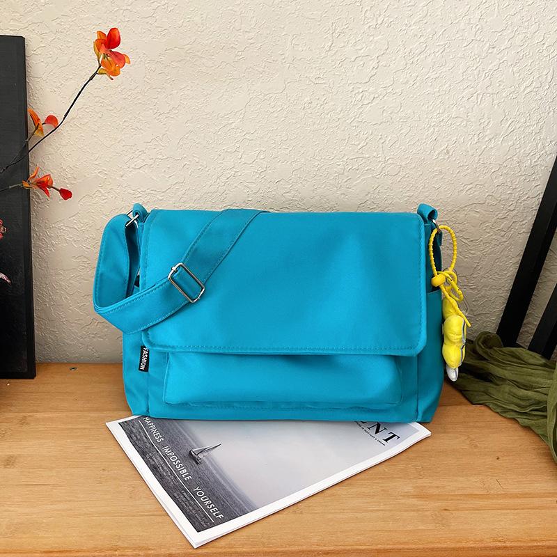 

Commuter and leisure nylon solid color simple large-capacity tote bag summer versatile simple trend shoulder messenger bag no pendant синій