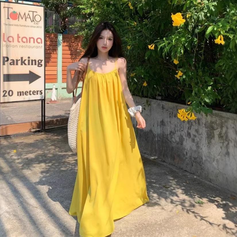 Seaside vacation sexy backless suspender dress women's summer new loose a-word skirt gentle yellow long skirt