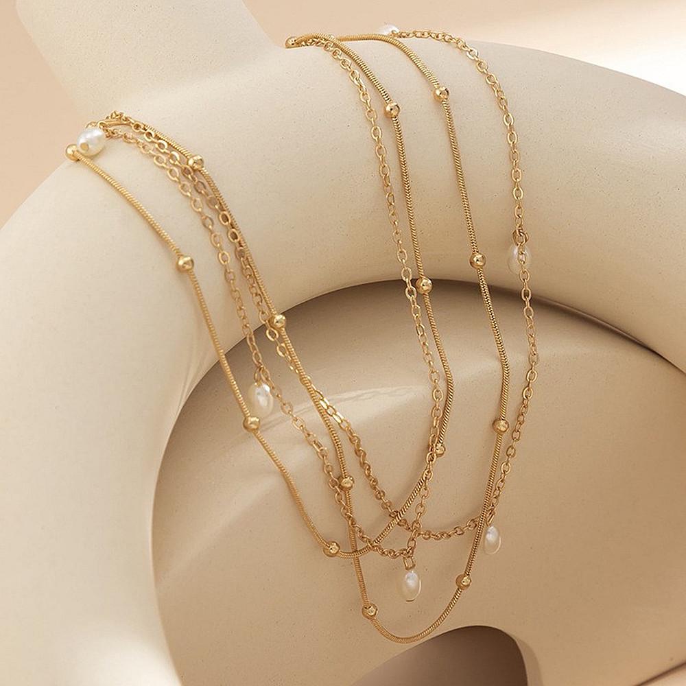 

Европейско-американская мода Двухслойная поясная цепочка с кисточками из искусственного жемчуга и круглыми бусинами золотой