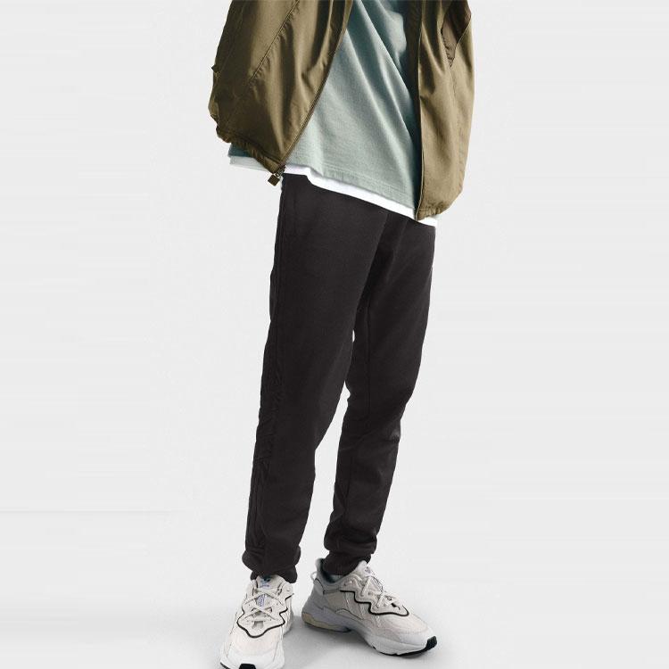 Adidas Jednobarevné ležérní tepláky s úzkými nohavicemi a středním pasem pro muže Černá IC5980