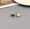 Qingdao Iridescent Geometric Wave Resin Stud Earrings: High-End Retro Fashion for Women