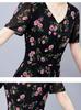 Elegant Summer Floral Print Dress: Knee-Length, Loose Fit, Slimming Waist, Short-Sleeved, Large Hem.